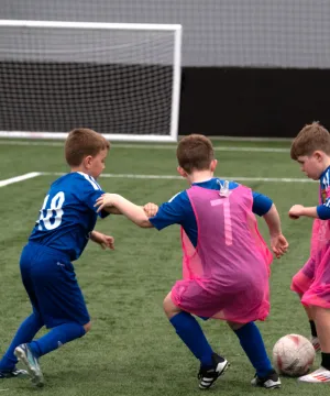 boys playing football