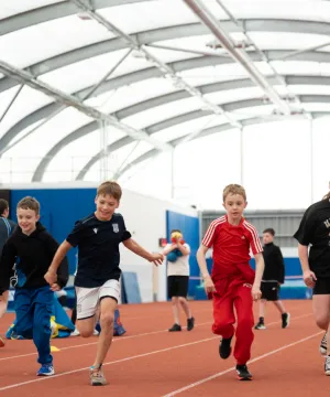 kids running on athletics track 