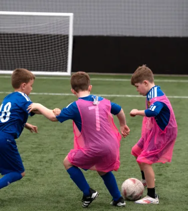 boys playing football