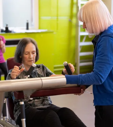 women speaking to instructor