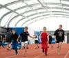 kids running on athletics track 