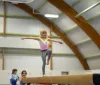 girl on gymnastics beam 