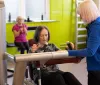 women speaking to instructor