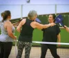 a group playing pickleball 